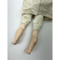 Early 20th century Cuno and Otto Dressel wax shoulder head doll with applied hair and fixed glass eyes, soft body with jointed composition lower limbs, maker's stamp to right thigh, clothing and box H38cm in original box