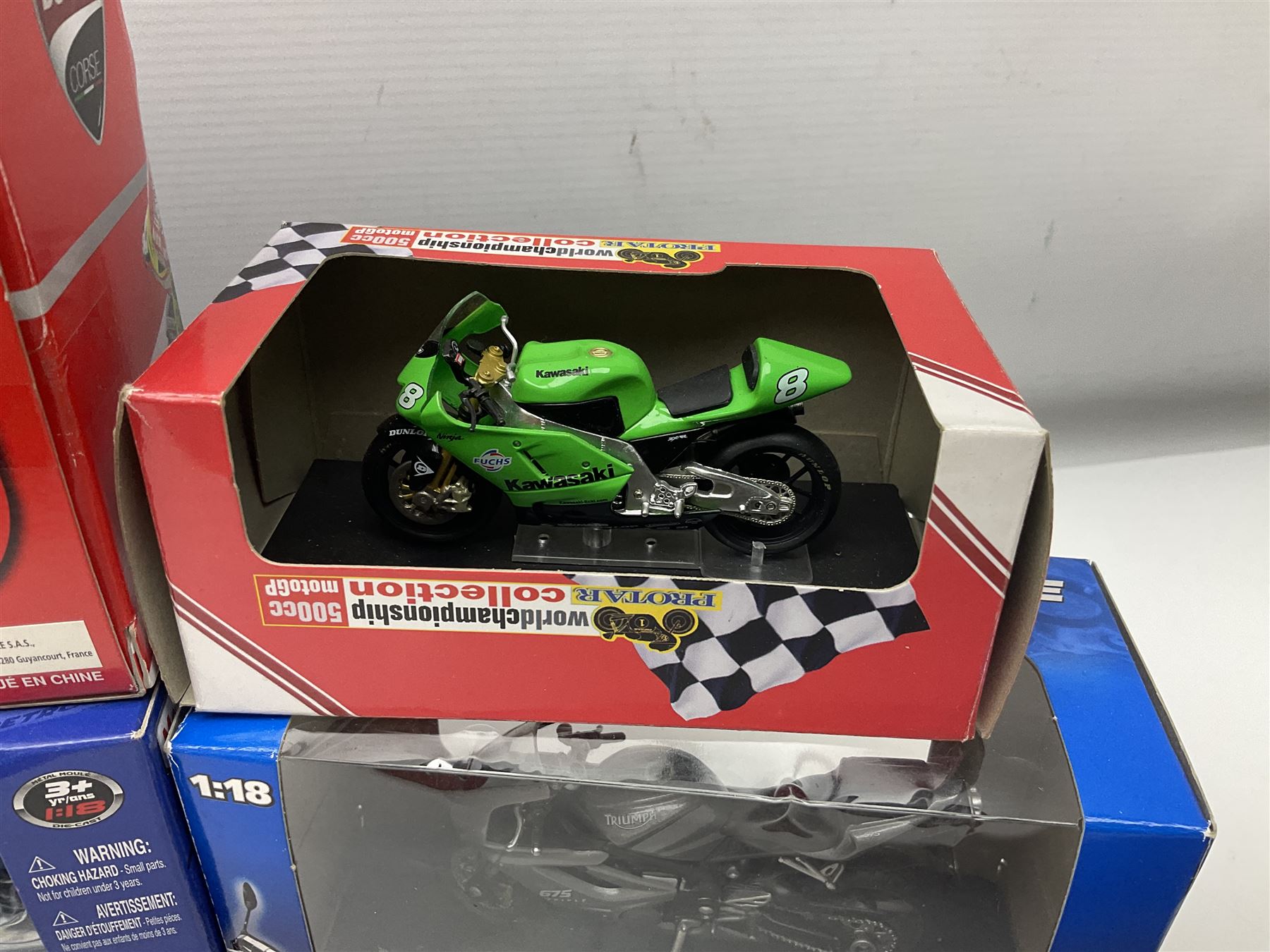 Fifty-one die-cast models of motorcycles by Maisto, Protar Italeri, Welly etc; many in perspex display boxes, some in window boxes and some unboxed