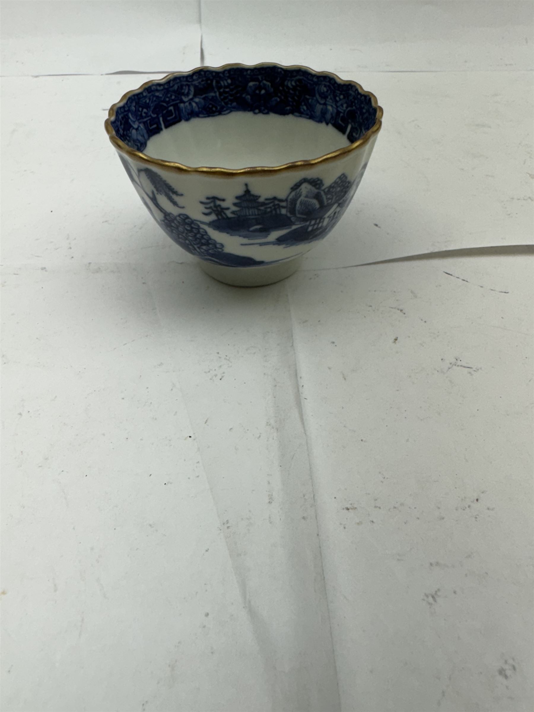 Pair of Staffordshire figures modelled as chained Dalmatians seated upon cobalt blue oval bases, H13cm, together with a Staffordshire pastille burner modelled as a castle, H12cm, a pair of 19th century Derby potpourri pots (lacking covers), and an 18th century blue and white tea bowl 