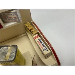 Late 1950s continental red and white painted wooden diorama of a grocery shop interior with fitted shelves and drawers and freestanding 'glazed' counter, fully stocked with miniature tin cans and packets of food L42cm H23cm D22cm