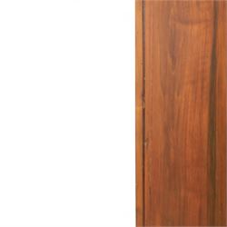 Edwardian walnut double wardrobe, featuring two mirrored doors with bevelled plates, carved frieze with fluted pilasters, above single base drawer