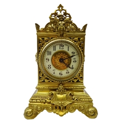  Late Victorian mantle clock with ornate cast and pierced brass case, the circular dial with Arabic numerals inscribed Fattorini & Sons, Bradford with eight day movement, H27cm   