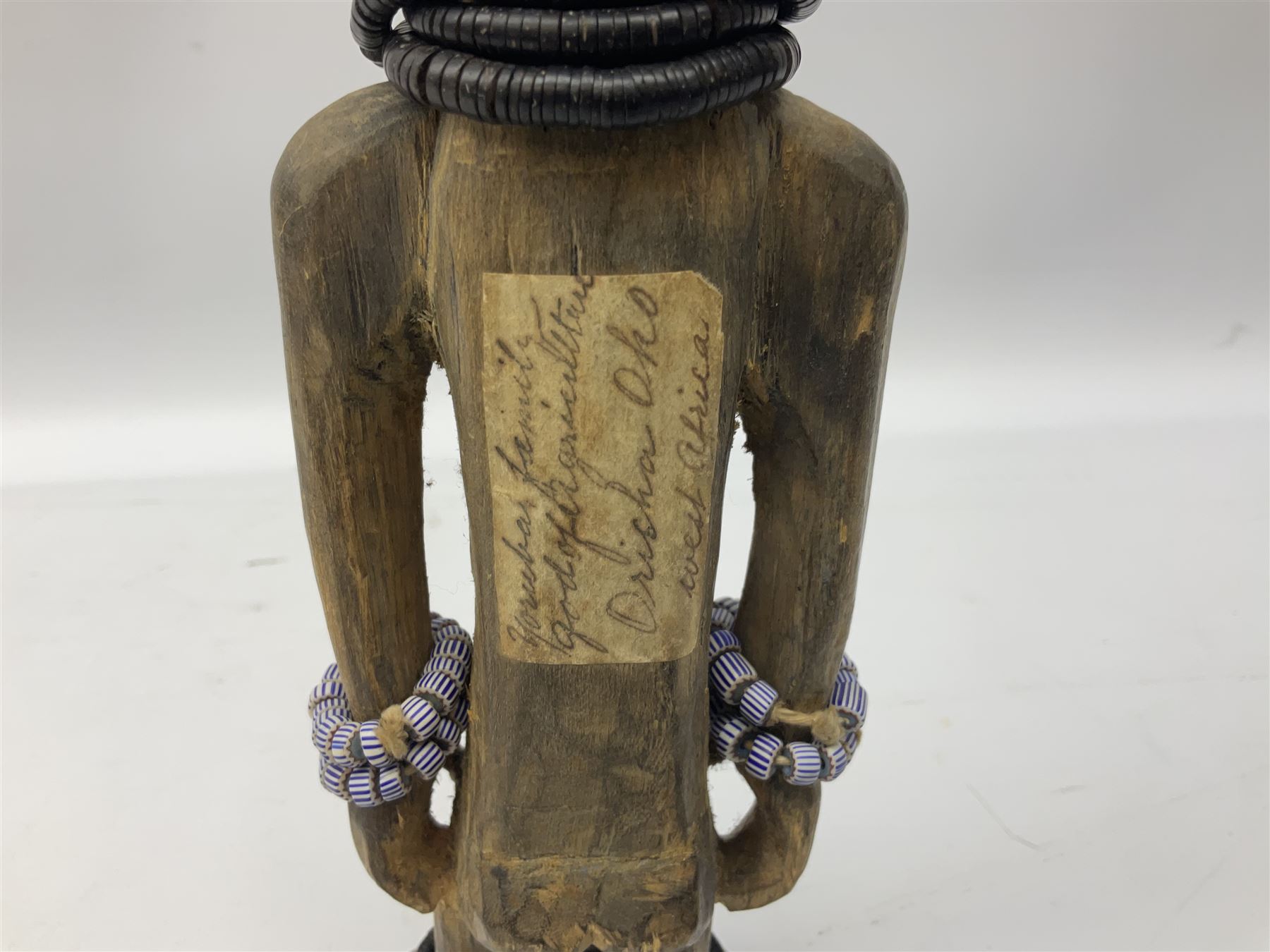 Early 20th century West African Yoruba family wooden figure of Orisha Oko, the god of farming/agriculture, carved from the solid, bears manuscript label of provenance verso H26.5cm