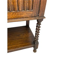 Early to mid-20th century oak dresser, raised two tier plate tack over two linenfold panelled doors, on spiral turned supports united by undertier 