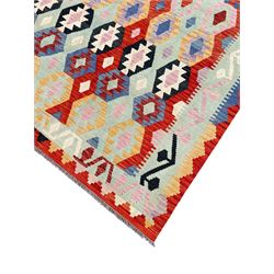 Large Kilim carpet, overall geometric design, decorated with lozenges within a tailing border, geometric guard stripes 