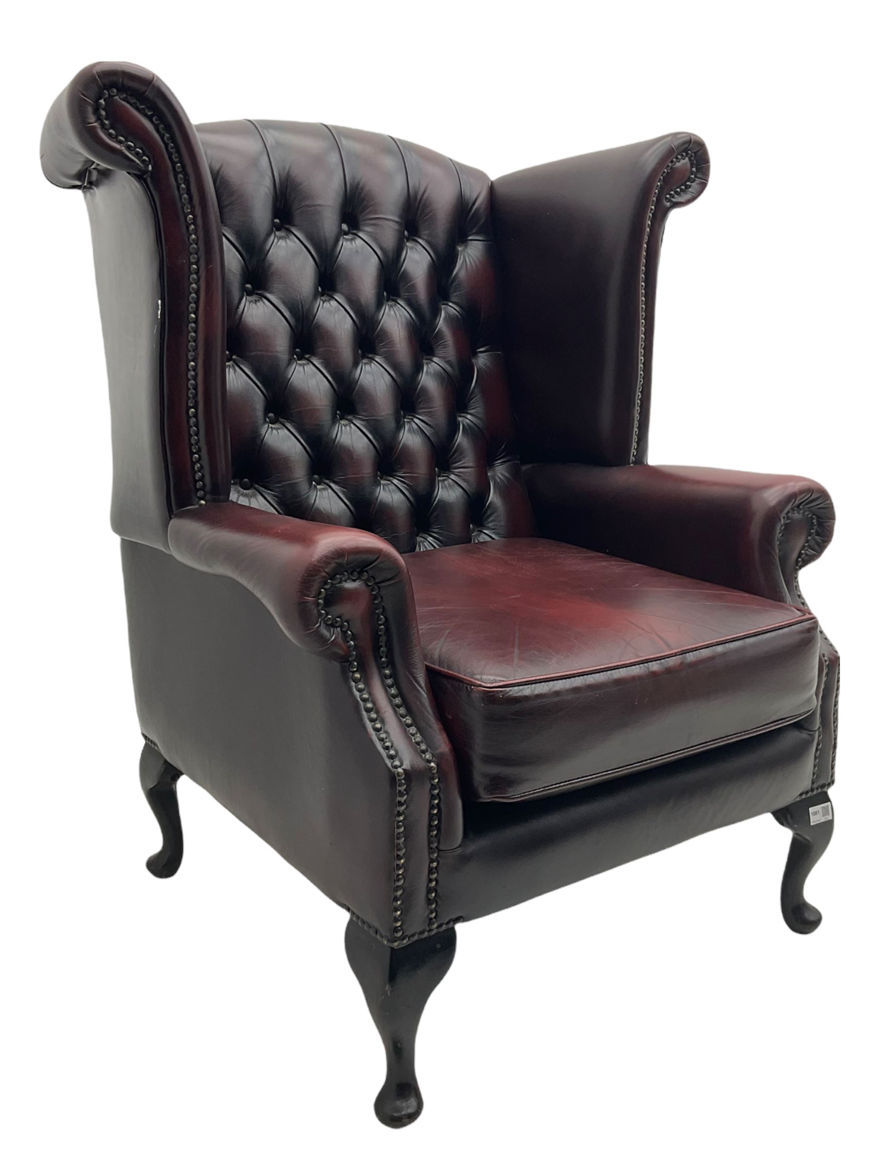 Thomas Lloyd - Georgian style wing back armchair, upholstered in buttoned oxblood leather