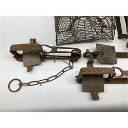 Quantity of animal traps including, gin traps, mole traps, Henri Marty wirework cage trap etc. Auctioneer's Note: These traps are sold as artefacts for ornamental purposes only as the use of some of them is illegal.