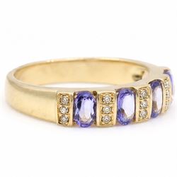 9ct gold tanzanite and diamond half eternity ring, four oval cut tanzanite's, each spaced by three single cut diamonds, hallmarked