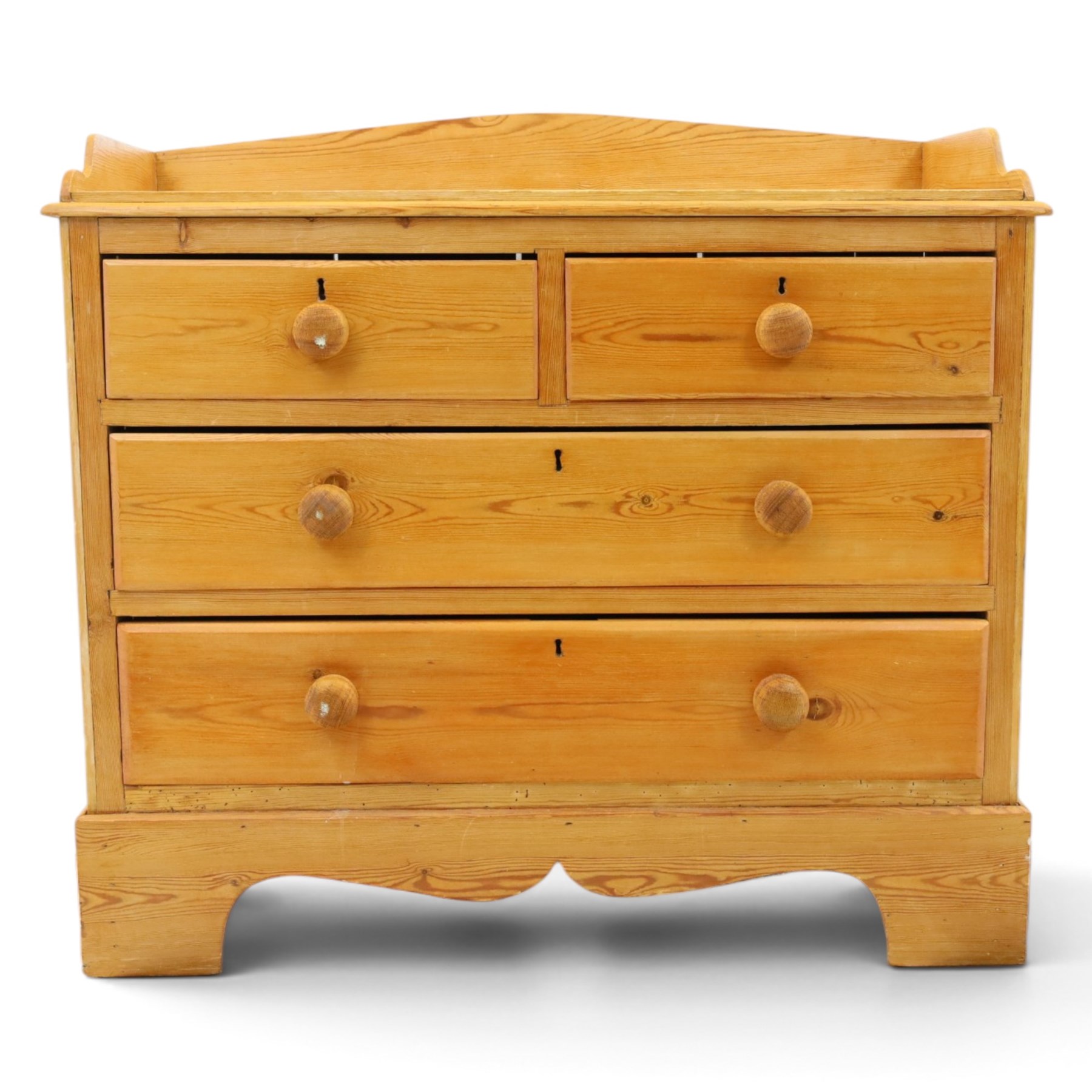 Victorian pine chest, galleried three quarter top, fitted with two short and two long drawers. with shaped apron and supports