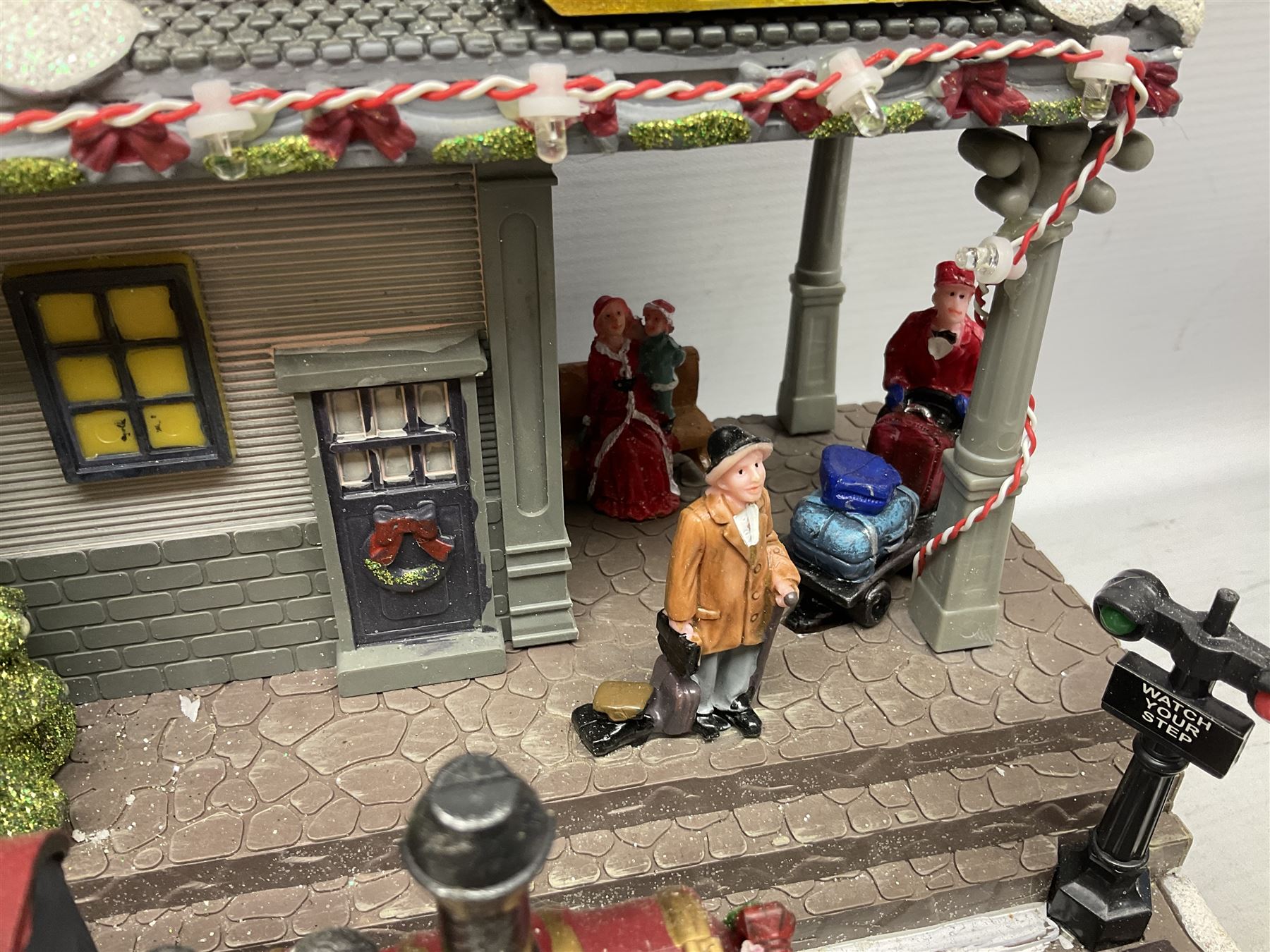 Christmas decorations; Premier LED Christmas Village scene with moving train, together with three Lumineo christmas scenes, and other similar 