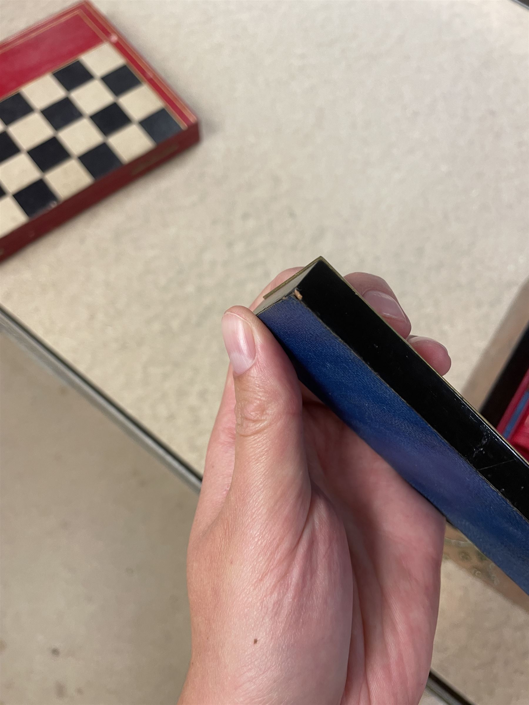19th century walnut and brass bound games compendium box, painted to enhance the grain, of rectangular form, the hinged opening cover with rounded sides, central brass cartouche with engraved lion crest, and brass riveted straps, opening to reveal a red leather and blue silk lined compartmented interior, with fold-down games board, and lift-out tray containing playing cards, ebony turned dice towers, white and red stained bone draughts, and chess pieces, ivory dice, and ivory and ebony whist markers, and brass bezique board, cribbage board and markers, H15cm W32cm D24cm
This lot has been registered for sale under Section 10 of the APHA Ivory Act