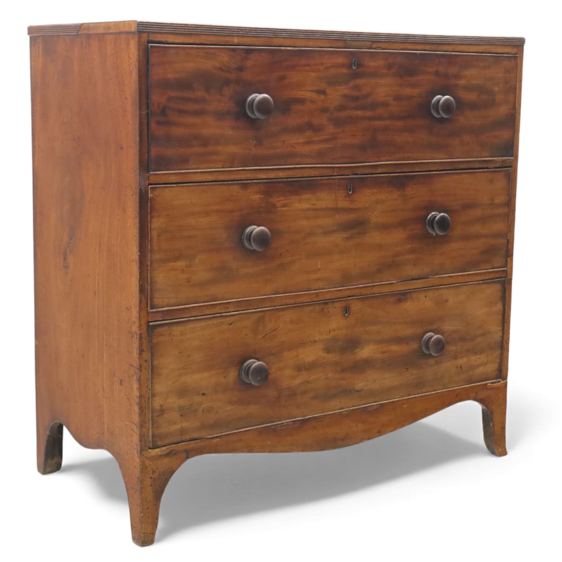 Early 19th century mahogany secretaire chest, the rectangular top over a fall-front fitted with pigeonholes and small drawers, above two long drawers with turned wooden knobs, upon swept bracket feet