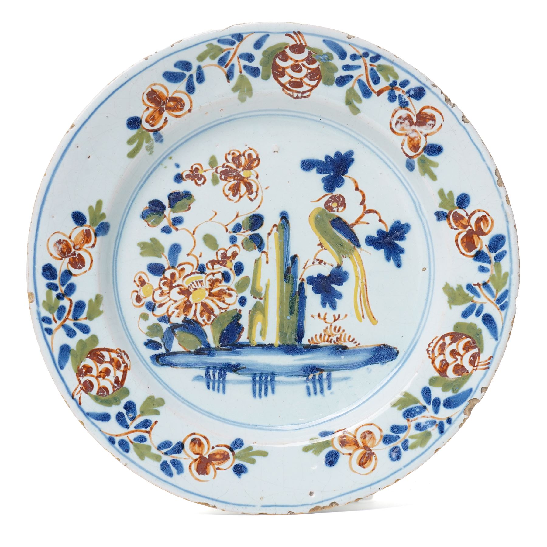 18th Century English Delft plate, probably Lambeth c1750, painted with a parrot on a branch among foliage, D22.5cm