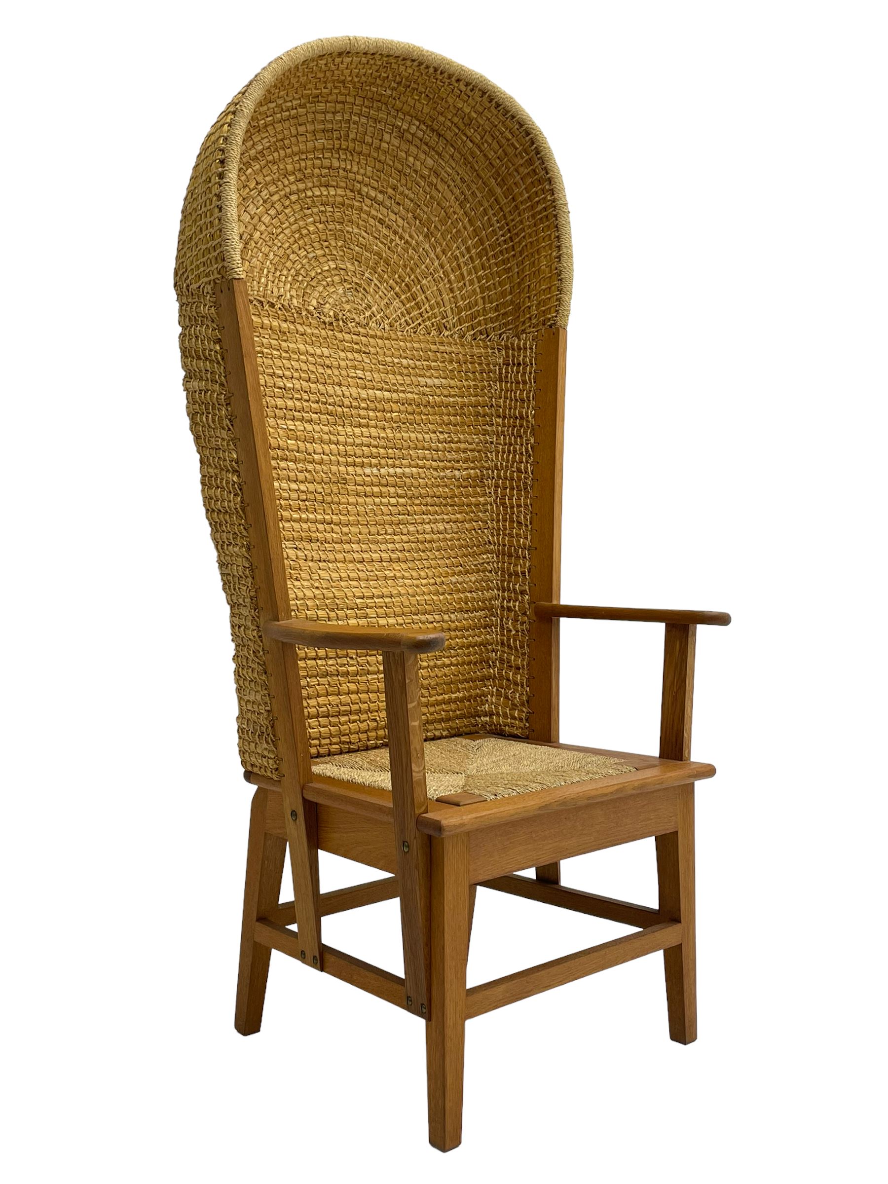 Reynold Eunson (1932–1978) for David Munro Kirkness, Kirkwall, Orkney - oak framed Orkney chair, woven straw canopy back, drop-in rush seat, the arm terminals carved with scrolls, on square tapering supports joined by plain stretchers, the front rail inscribed with makers marks
