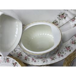 Minton Spring Bouquet pattern dinner and tea service, comprising dinner plates, twin handled tureens with covers, meat platter, teapot, milk jug, sugar bowl with cover, tea cups and saucers, bowls, cake plate, side plates, dessert plates, etc all with printed mark beneath (82)