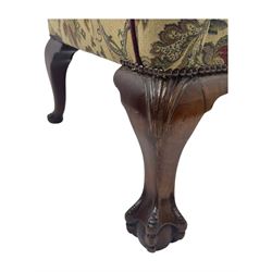 Mid-20th century William and Mary design two-seat sofa, upholstered in floral patterned fabric with contrasting piping, featuring camel-shaped back and scroll arms, on cabriole supports