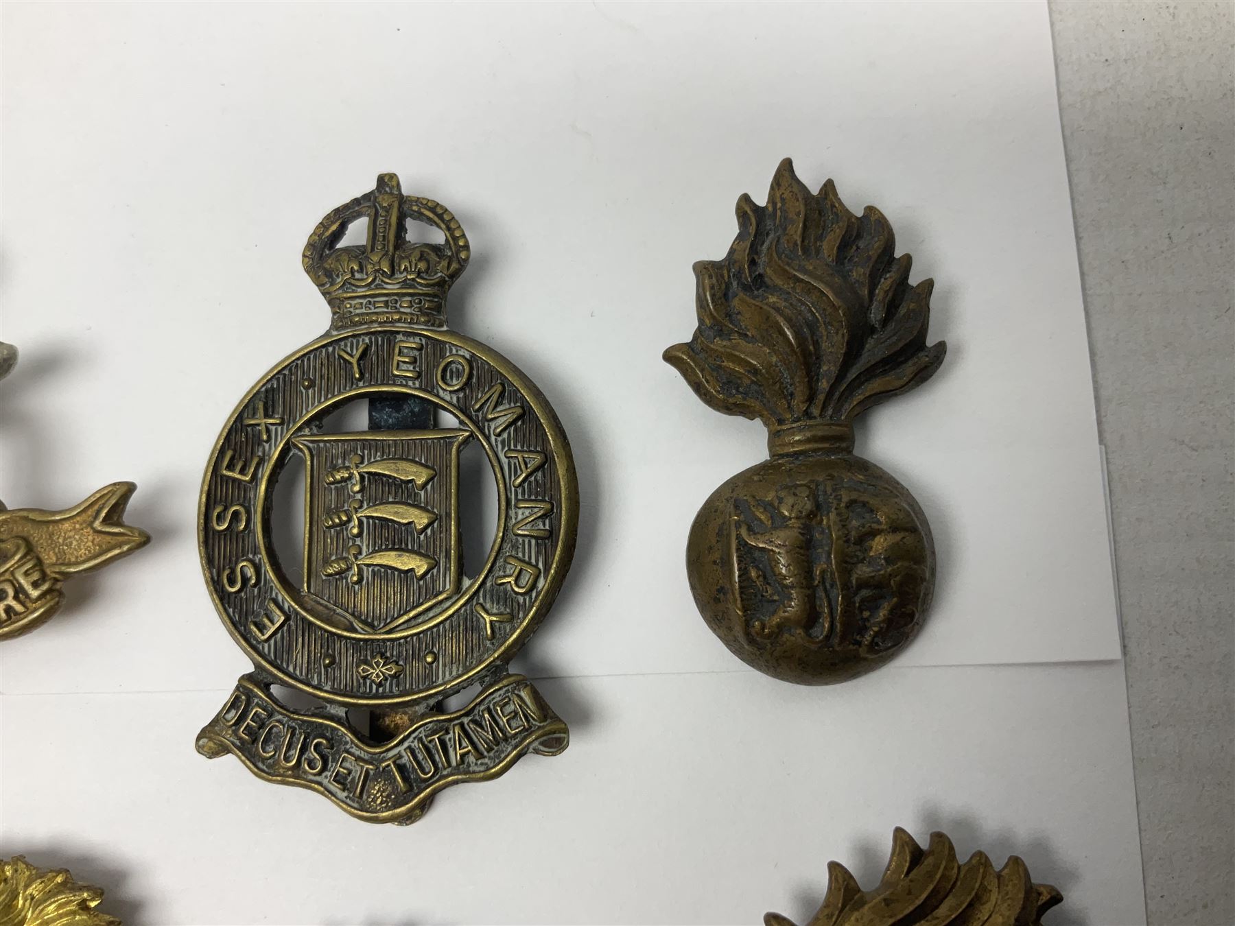 Nineteen Yeomanry metal cap badges including Derbyshire, Northamptonshire, Essex, Glamorgan, Staffordshire, City of London, Surrey, Shropshire, Hertfordshire etc; together with eleven Fusiliers badges including Lancashire, Royal Welch, Northumberland etc (30)