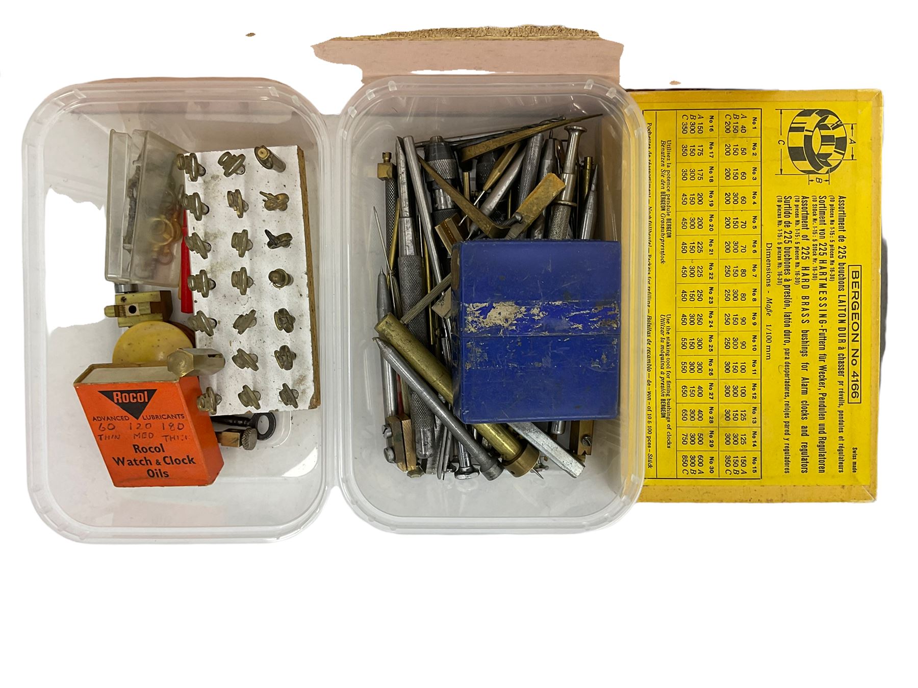 Clock mainspring winder, bench vice, assortment of clock pivot steel