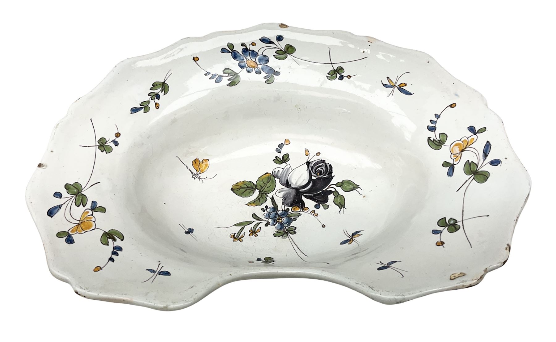 19th century French faience barber's blood-letting bowl, with painted floral decoration in polychrome upon plain ground, with painted initials CT mark beneath, L31cm
