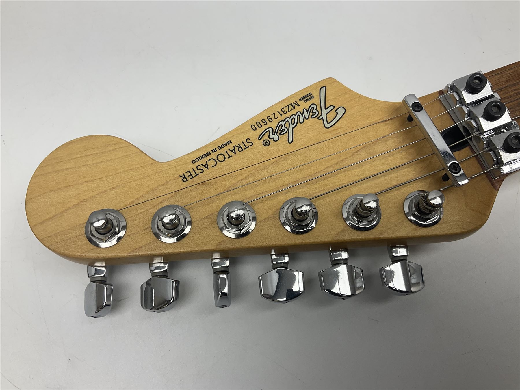 Mexican Fender Stratocaster electric guitar in black c2003 with Floyd Rose tremolo system, serial no.MZ3129600; L98cm; in Freestyle fitted case with 2006 Diamond Anniversary booklet