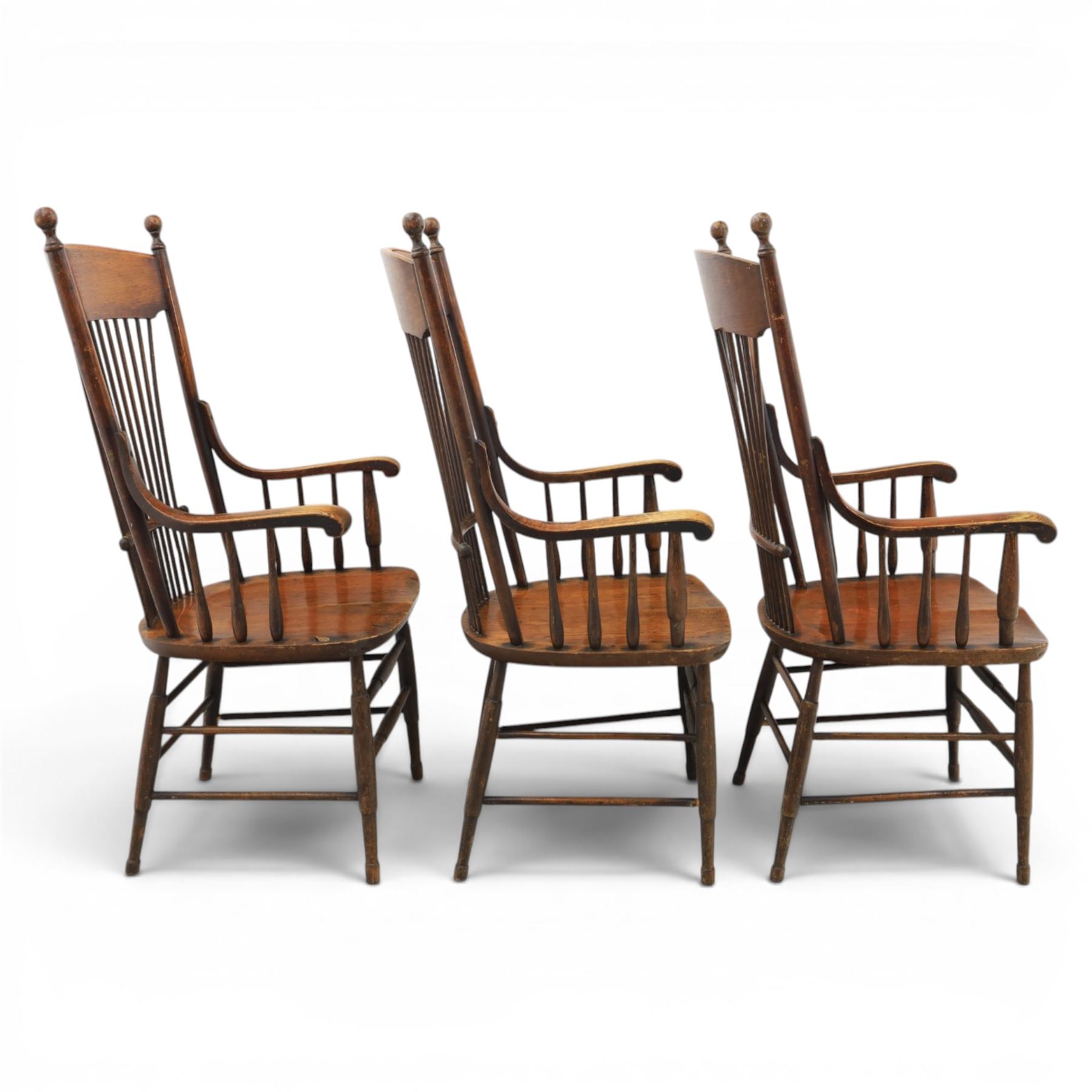 Set of three 19th century ash and elm spindle back Windsor armchairs, arched top rails above fan-shaped spindle backs, curved arms with turned supports, shaped saddle seats, on turned legs joined by H-stretchers