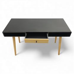 Modern black single drawer desk, black rectangular top above a single oak veneered drawer with black metal pull, flanked by two open shelves raised on tapering oak veneer legs (From floor to underside 64cm)