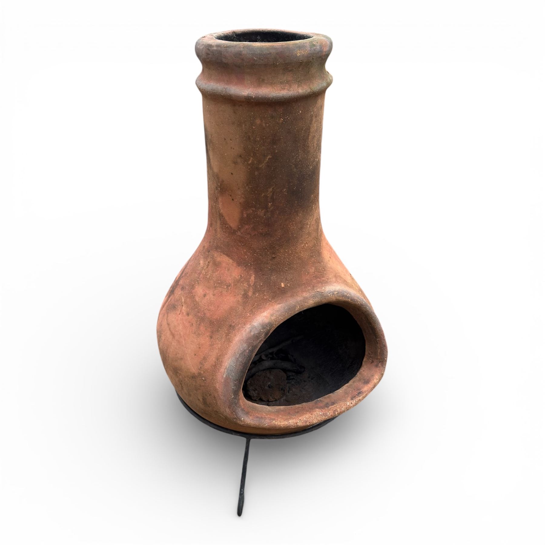 Terracotta chimney patio heater on metal stand