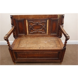 Early 20th century carved oak Monks bench, carved lions head arms, barley twist supports, hinged seat, W114cm, H76cm, D54cm  