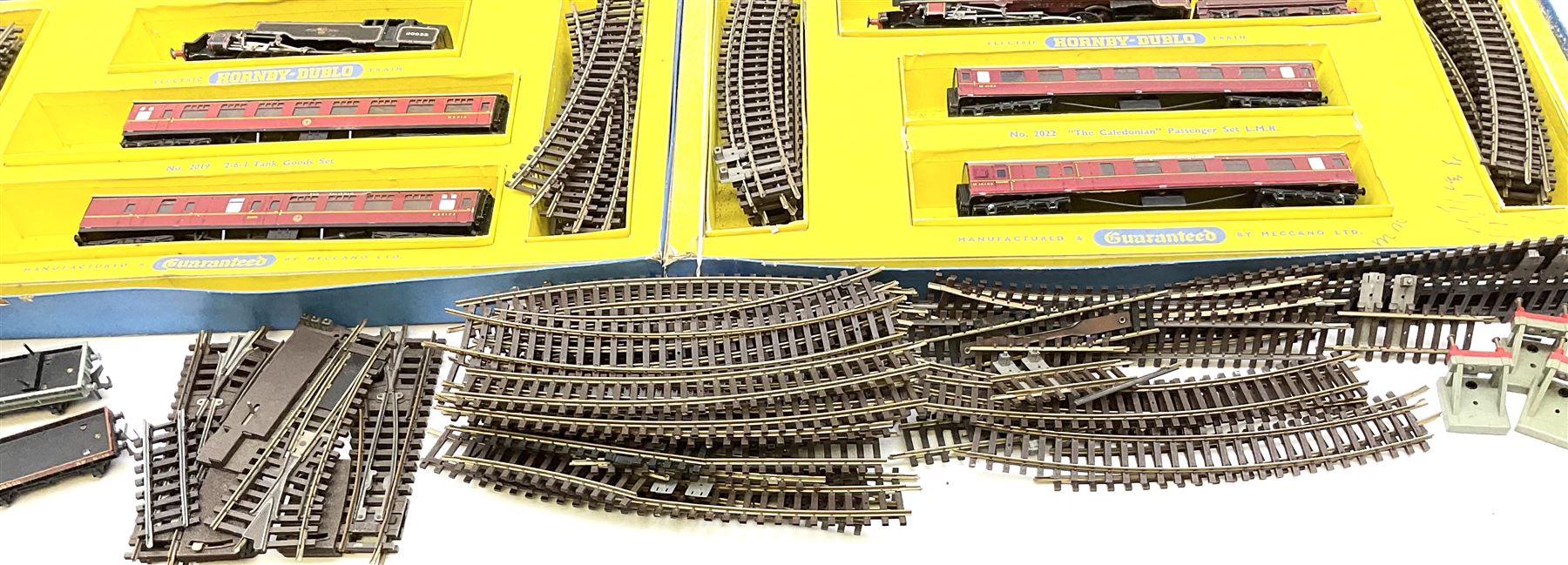 Hornby Dublo - two-rail 2022 'The Caledonian' Passenger Set LMR with Duchess Class 4-6-2 locomotive 'City of London' No.46245 with tender, two coaches and track, box base only, no lid; 4MT Standard 2-6-4 Tank locomotive No.80033 with two Talisman coaches and track in 2019 Goods Train Set box; four unboxed wagons, quantity of track, crane and buffer stops.