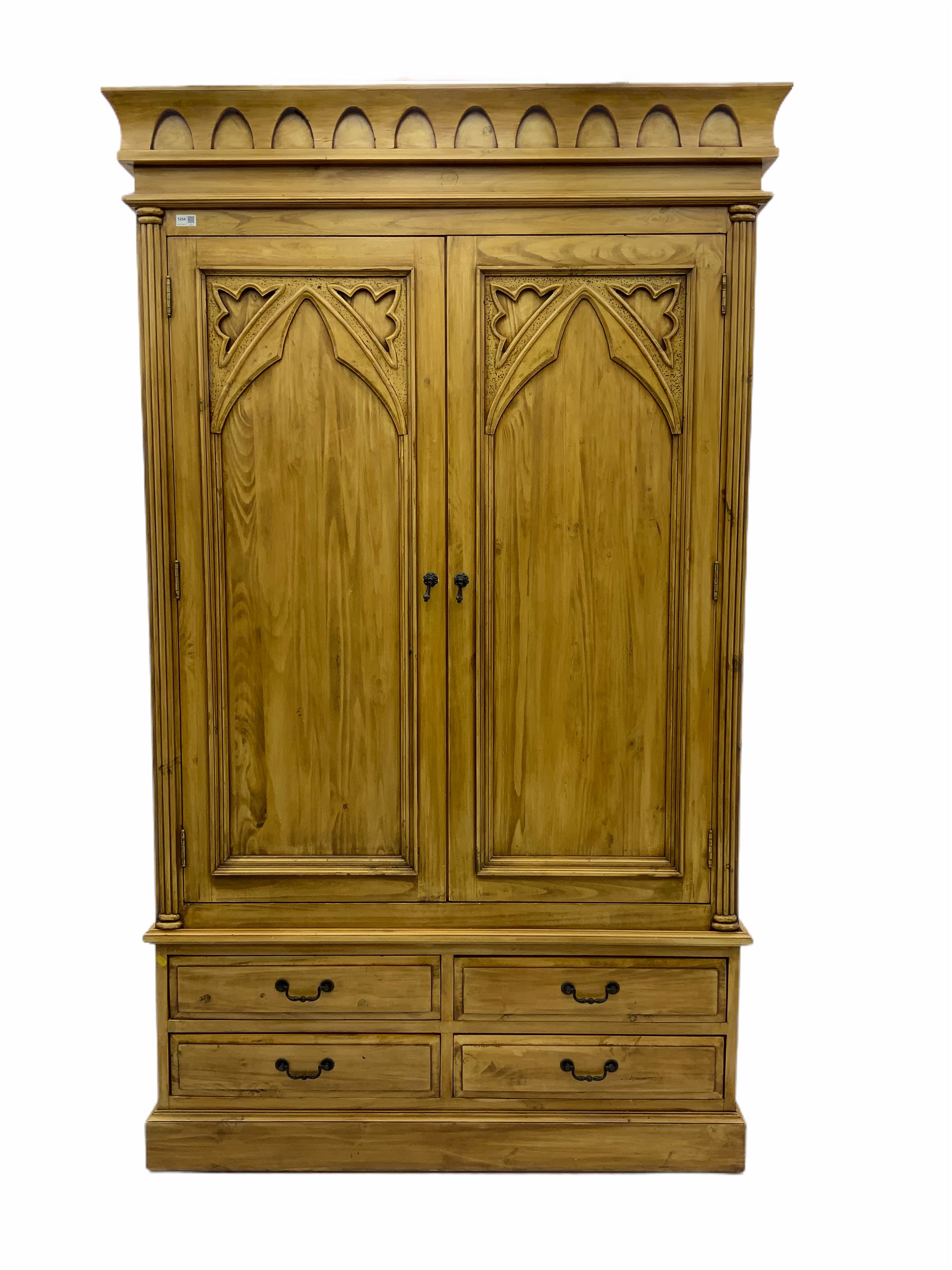 Gothic polished pine double wardrobe, fitted with four drawers