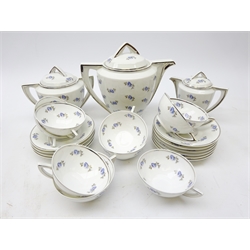  Art Deco Limoges Unique tea service, stylized handles, silvered borders on rose sprig printed ground comprising teapot, milk pot, sugar pot, nine cups and ten saucers   