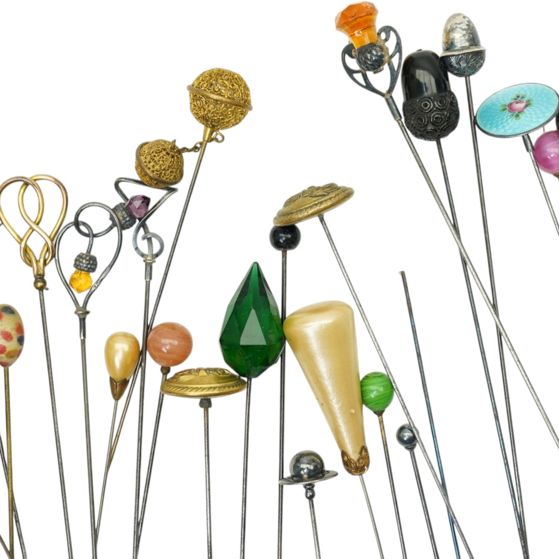 Collection of early 20th century and later hat pins including six silver mounted examples by Charles Horner, pique work, faceted class, jet acorn, filigree etc