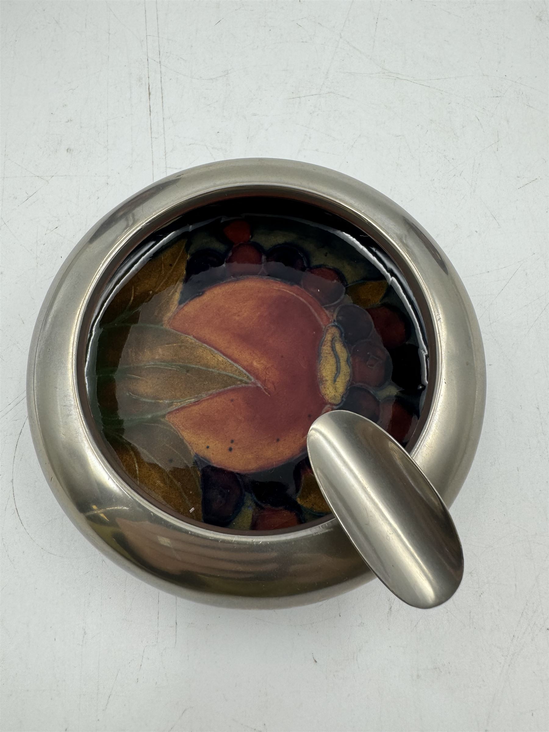 Moorcroft pewter-mounted circular ashtray decorated in Pomegranate pattern, together with Anemone pattern ashtray and trinket dish, all with makers mark beneath    