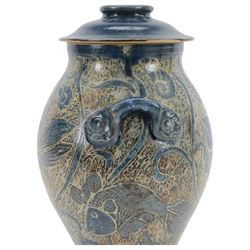 John Egerton (c1945-): studio pottery stoneware vase and cover, decorated with fish and ammonites upon a blue ground, H38cm