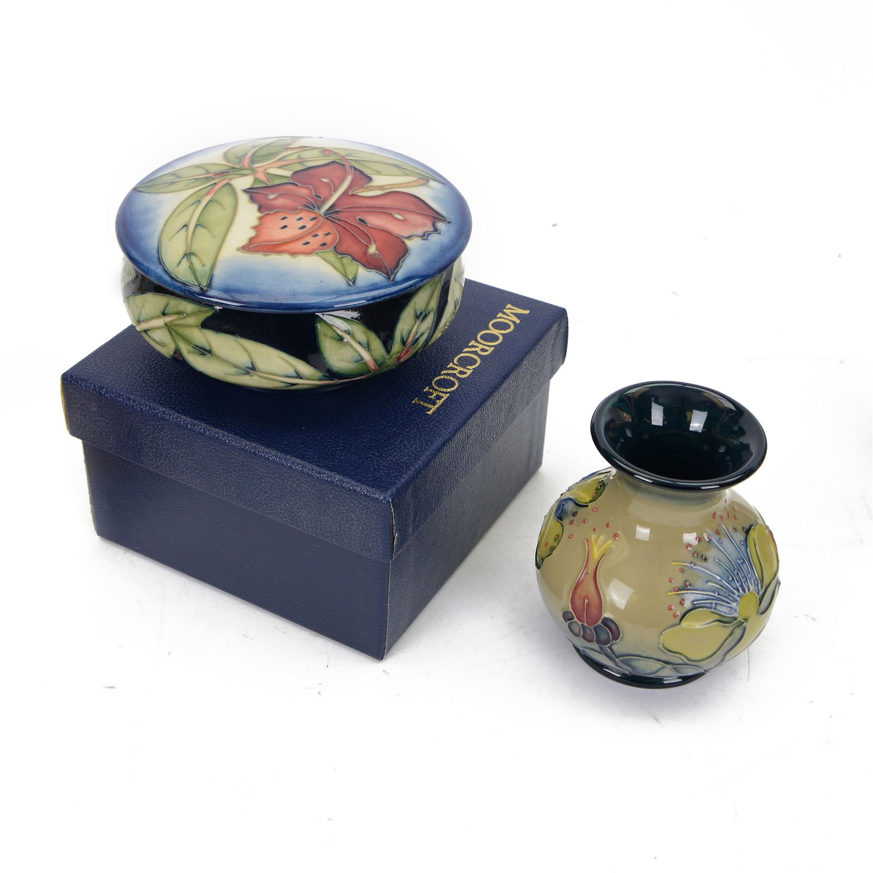 Moorcroft vase in Hypericum pattern, of baluster form, in original box, together with a Moorcroft covered dish in Simeon pattern, both with printed marks beneath, vase H10cm