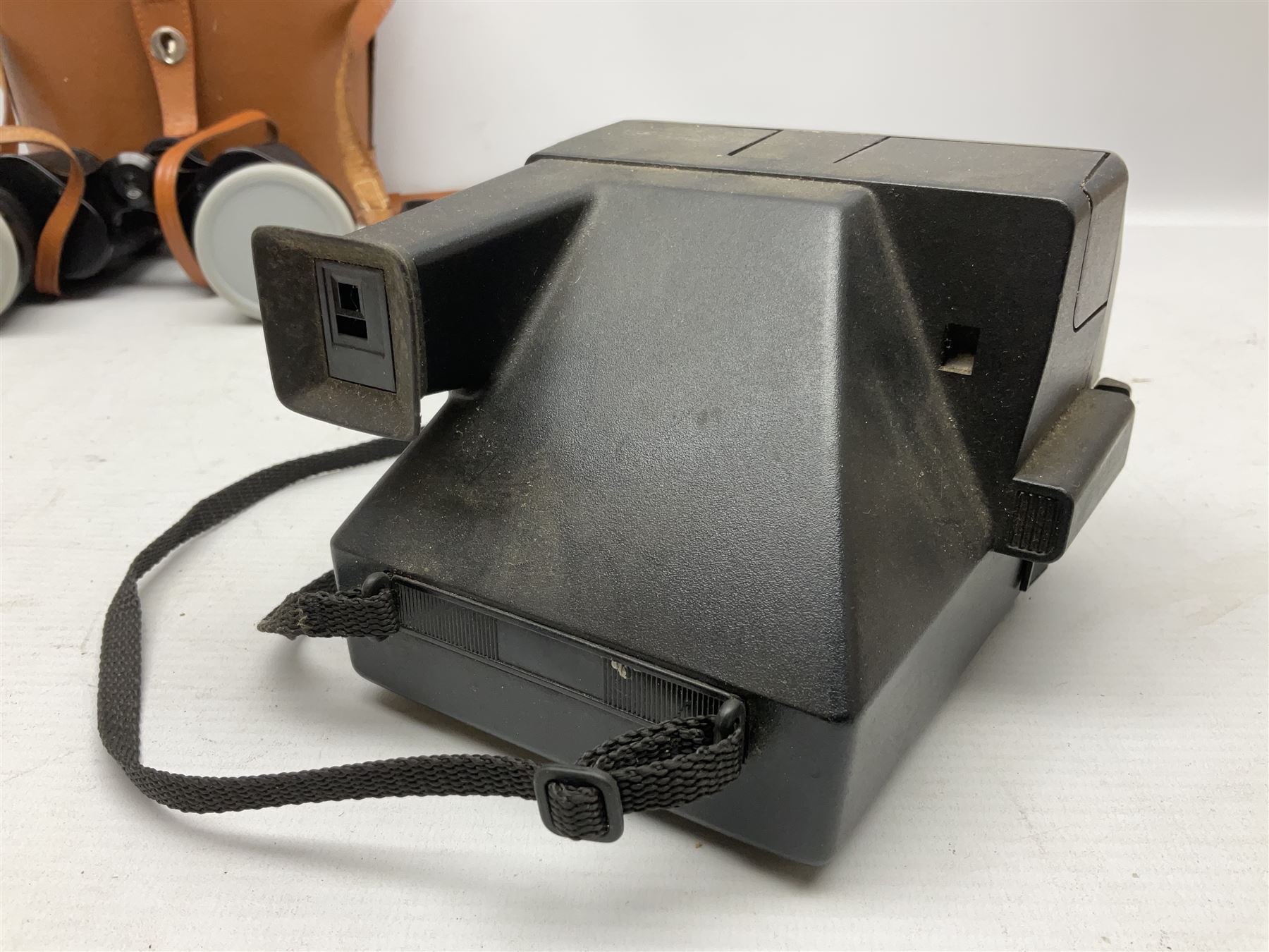 Brass telescope, together with Zenith 7 x 50 field binoculars, two polaroid cameras and other cameras and equipment 