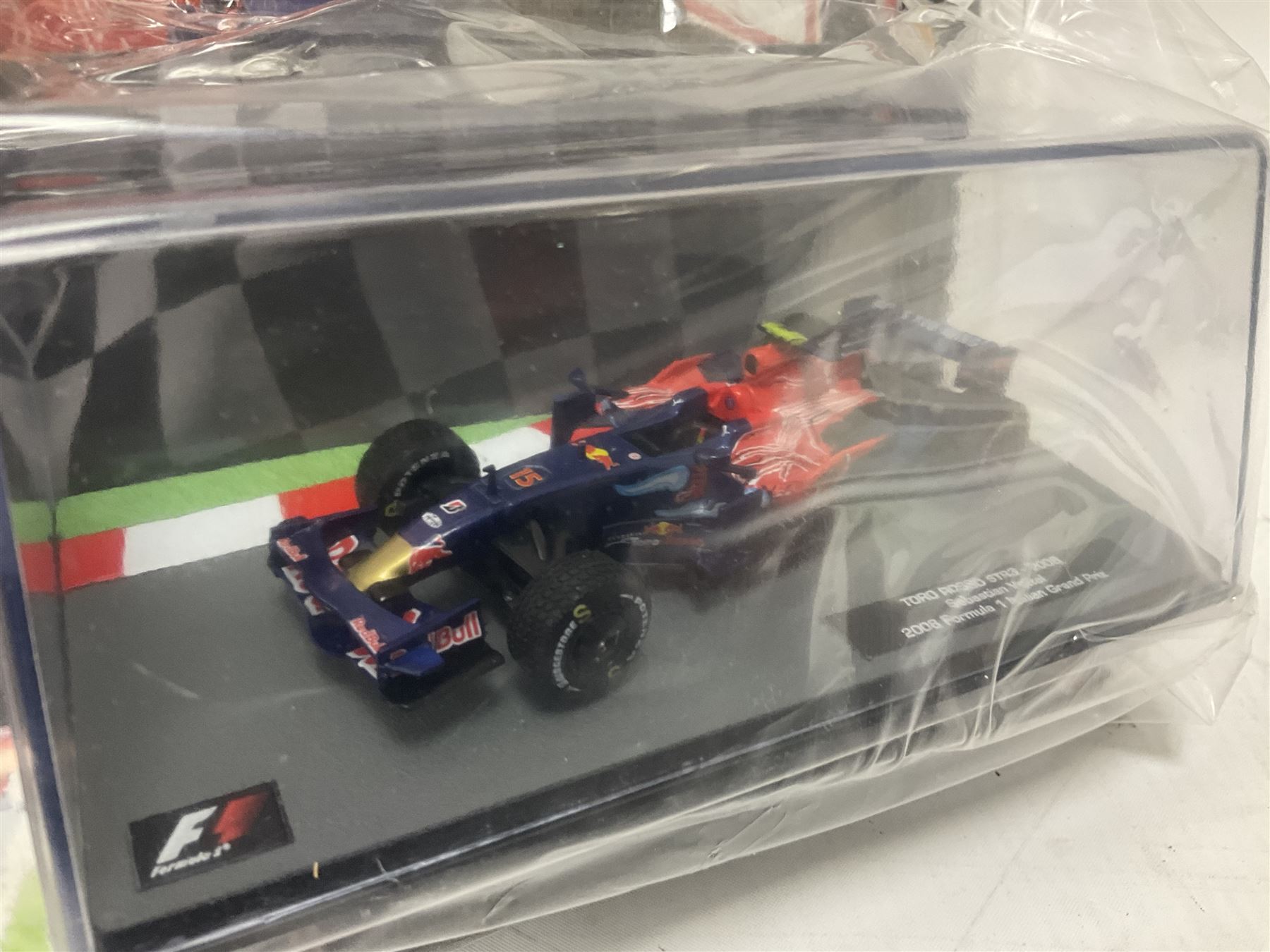 Panini Formula 1 The Car Collection - twelve die-cast models including ten in unopened packaging with periodical; all models in plastic display boxes; and eight other boxed die-cast models of racing cars by Corgi, Onyx, Classico, Minichamps etc (20)