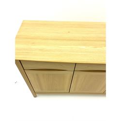 Light oak sideboard, fitted with three long drawers, above three cupboards enclosing fitted shelving pan stile supports 