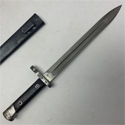 Austrian Model 1895 Carbine knife bayonet with 24.5cm fullered steel blade; various marks to the ricasso including F.G. GY.; cross-piece marked No.7843; in steel scabbard L37cm overall