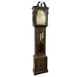 German - 8-day oak longcase clock c1910, with a carved case, swan necked pediment and fully glazed trunk door, brass dial with a silvered chapter ring with Roman numerals, minute track and silvered 