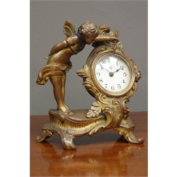  Small gilt metal cartouche mantel clock, with winged putti figure, circular Arabic dial, H15cm  