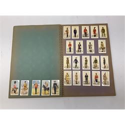 Magnus Laurie: The West Riding Territorials in the Great War. 1920: German Haus Neuerburg cigarette card album entitled Der Bunte Rock depicting 19th century military uniforms; French Chocolat Aiglon trade card album including some military costumes; and a cigarette card album, some of military interest (4)