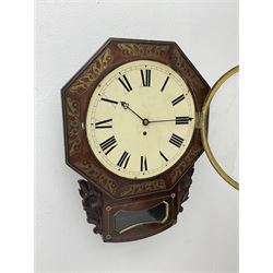 Mid-19th century mahogany veneered eight-day four-pillar single fusee drop dial wall clock with an octagonal dial surround and scroll brass inlay, circular painted steel dial with roman numerals and minute track, matching trefoil steel hands, brass bezel with a flat glass, curved trunk with brass inlaid circles and stringing around the glass pendulum aperture with a brass slip, carved ear pieces in the form of flowers and leaves, with pendulum adjustment door and movement door.