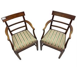 Pair of 19th century elm elbow chairs, bar back over horizontal rails, drop-in seats upholstered in striped fabric, on square tapering supports united by stretchers