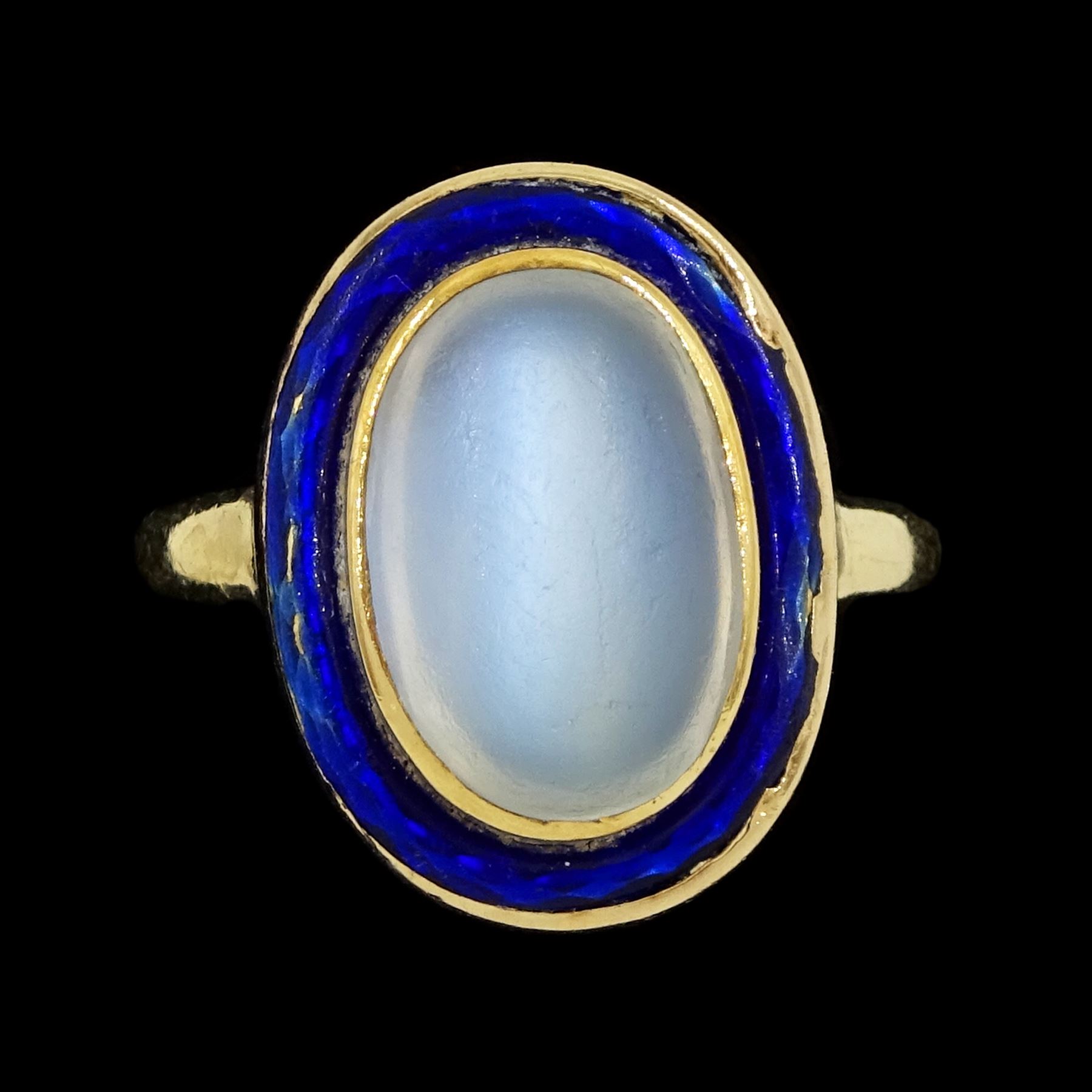 Early 20th century moonstone and blue enamel ring, stamped 9ct