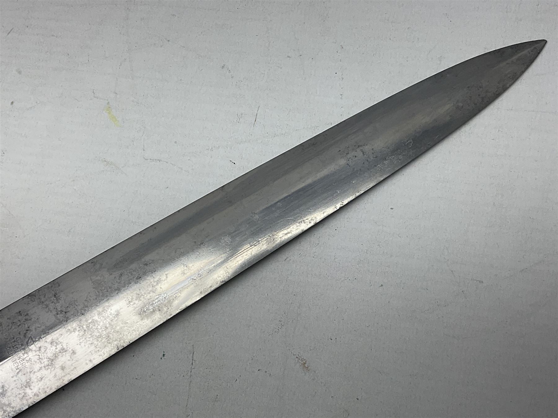 WW2 German SA dagger the 22cm double edged steel blade by G. Felix Gloriawerk Solingen inscribed 'Alles Fur Deutschland', the cross-piece impressed with the SA Gruppen mark Nm verso for Nordmark, wooden grip inset with eagle and SA emblem; in brown painted scabbard with nickel mounts L37cm overall