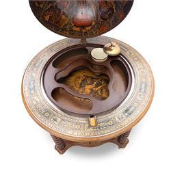 20th century Italian reproduction globe drinks table, the cartographic sphere decorated with Renaissance-style map scenes, hinged upper section enclosing bottle storage, with printed zodiac and calendar ring to the top, on spiral-turned legs joined by a compass rose undertier, brass castors below