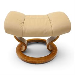 Ekornes Stressless - beech framed reclining swivel armchair with matching footstool, on U-shaped supports with circular bases, upholstered in beige leather