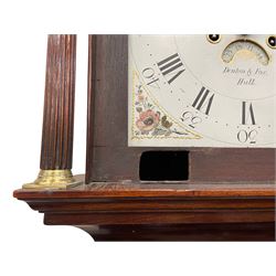 Denton & Fox of Hull – Early 19th century mahogany 8-day longcase clock c1802, pagoda pediment with an oval inlay and three ball and spire finials, break arch painted dial and hood door flanked by reeded pilasters with brass Corinthian capitals, long trunk door with conforming break arch top on a rectangular plinth raised on bracket feet, early Wilson (Birmingham) dial with Roman numerals, five minute Arabic’s and minute dots, subsidiary seconds dial and calendar aperture, with matching steel hands, floral spandrels within raised gesso work and a conforming oval depiction of a young maiden and dog to the break arch, dial pinned via a falseplate to a rack striking movement with a recoil anchor escapement striking the hours on a cast bell. With pendulum and weights.
Joseph Denton was a respected and prolific Hull clock maker working in Scale Lane Hull 1779 and Silver Street 1782-1814. Entering a short-lived partnership with Charles Fox from Beverley in 1802.
