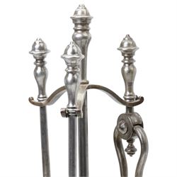 19th century fireside three piece fireside companion, H69cm; together with three further fire irons, and three bellows, one set with crest 
Provenance: Kirkham Hall

